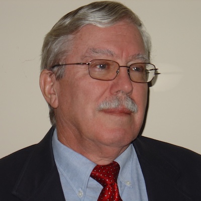 A headshot of Dr. James Watt, PhD.