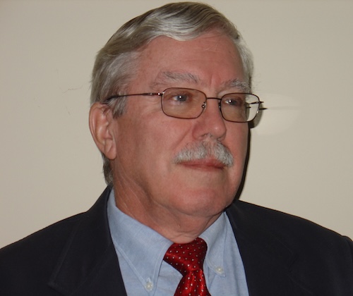 A headshot of Dr. James Watt, PhD.